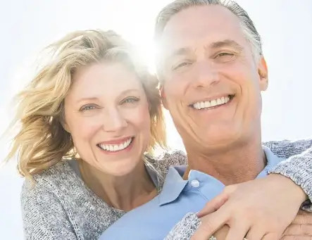 Family smiling after getting dentures Richmond