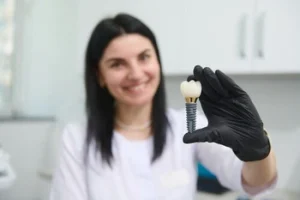 Dental Implant shown by a dentist for Cost and consult